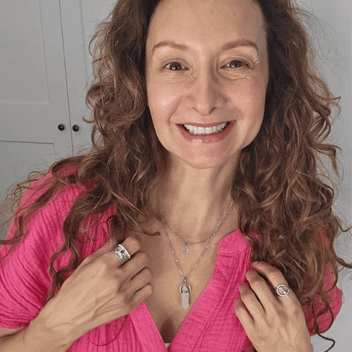 Woman wearing a clear quartz aura necklace